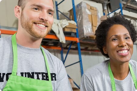 Men and Women Smiling while attend the customers